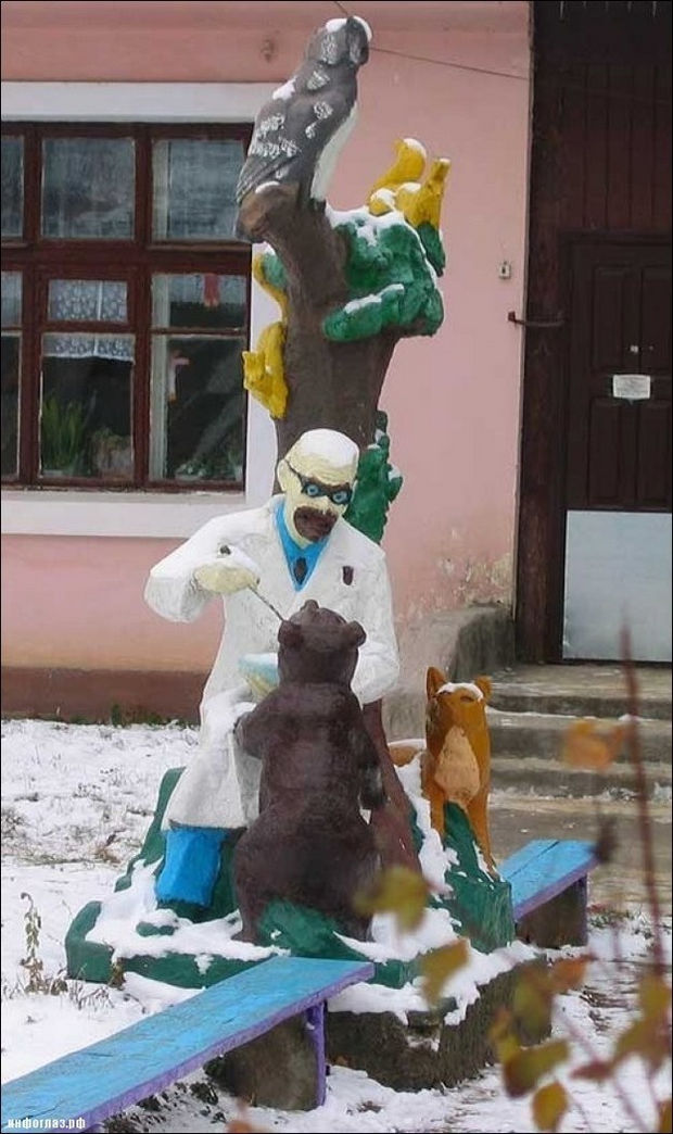 20 Creepy Playgrounds - What is he feeding that bear?
