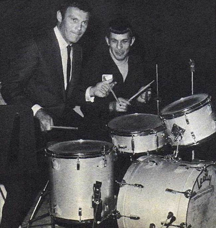 Adam West (Batman) & Leonard Nemoy (Spock) playing on a drum set.