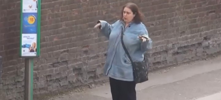 This woman dancing at a bus stop can't stop dancing.