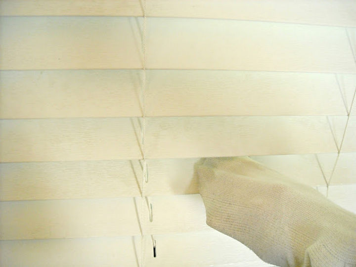 16 Cleaning Tips and Hacks - Clean dirty blinds using a sock.