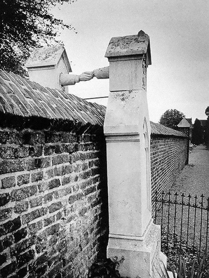 21 Historical Photos - The graves of a Catholic woman and her Protestant husband, Holland, 1888.