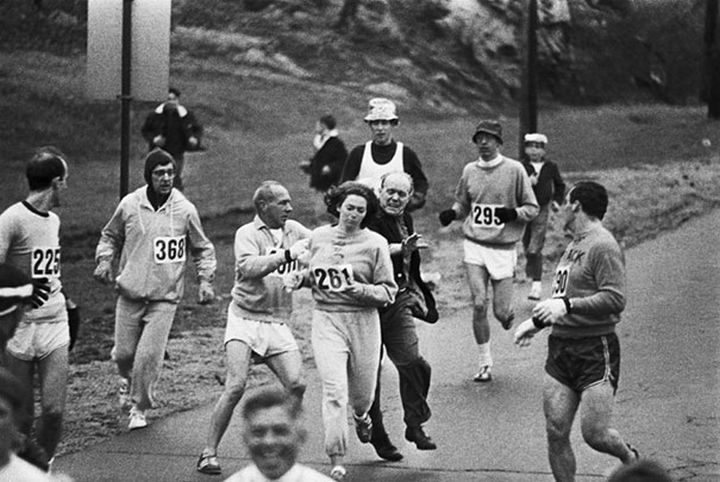 21 Historical Photos - Race organizers try to stop Kathrine Switzer from competing in the Boston Marathon. She became the first woman to run the race as a numbered entry, 1967.