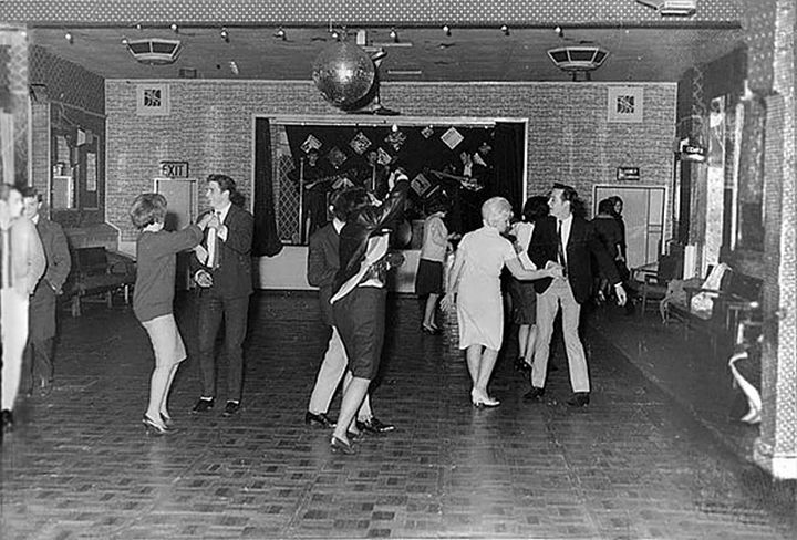 21 Historical Photos - The Beatles play for 18 people at the Aldershot Club, 1961. They were to become superstars in one and a half years time.