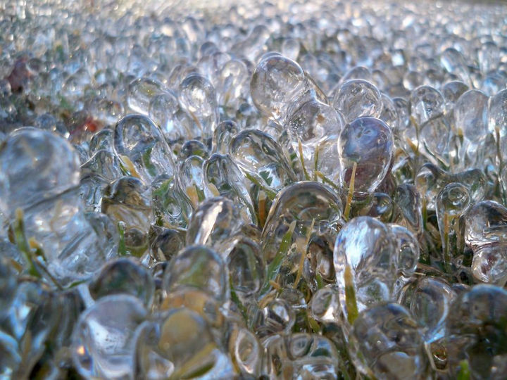 22 Ice and Snow Formations - Ice bubbles forming on the grass.