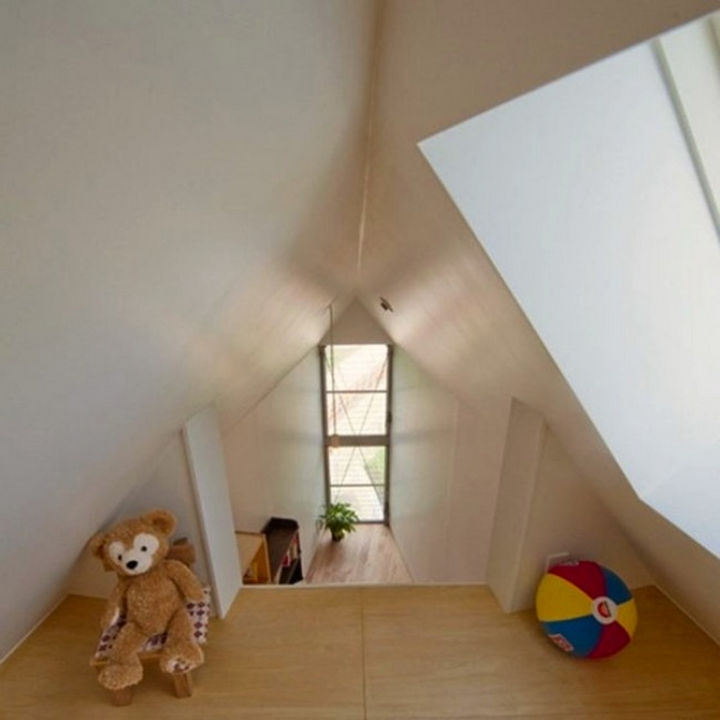 Small House Design in Japan - The loft features high vaulted ceilings which creates a sense of space.