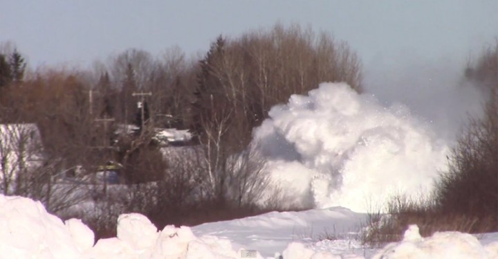 Train Barrels through a Mountain of Snow in New Brunswick.
