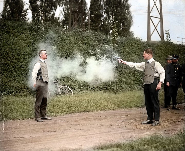 58 Colorized Photos from the Past - W.H. Murphy and his associate demonstrating their bulletproof vest in October, 1923.