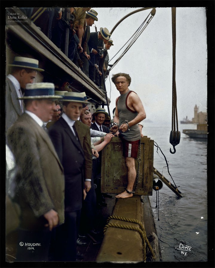 58 Colorized Photos from the Past - Harry Houdini steps into a crate at New York Harbor as part of an escape stunt in July, 1912.