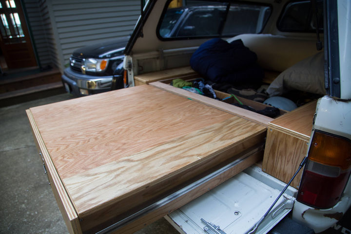 A portion of the top sheet can be removed and set on top of the drawer to create a table!