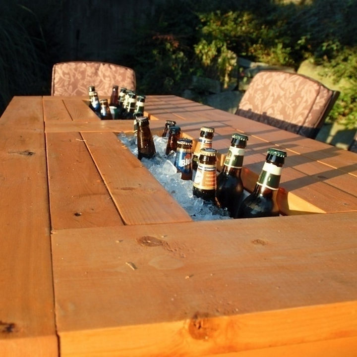 34 DIY Backyard Ideas for the Summer - Create a patio table with a built-in beer and wine cooler.