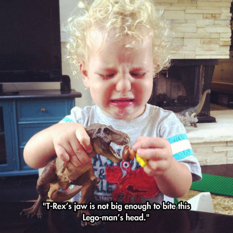 37 Photos of Kids Losing It - T-Rex's jaw is not big enough to bite this Lego-man's head.