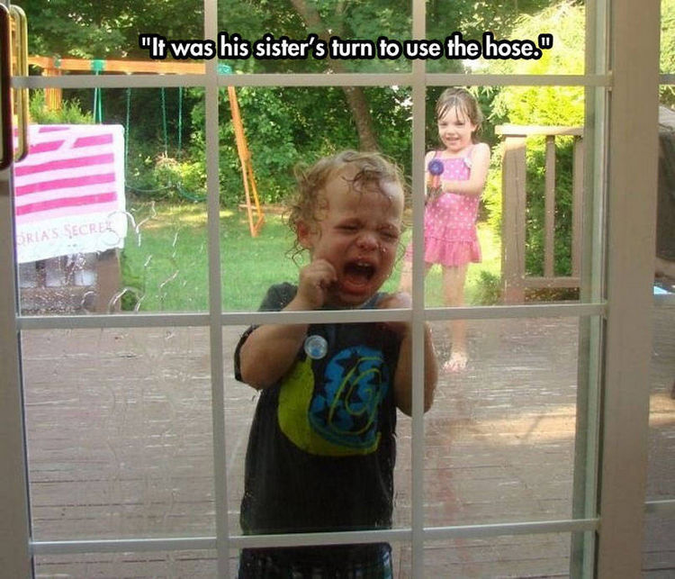 37 Photos of Kids Losing It - It was his sister's turn to use the hose.