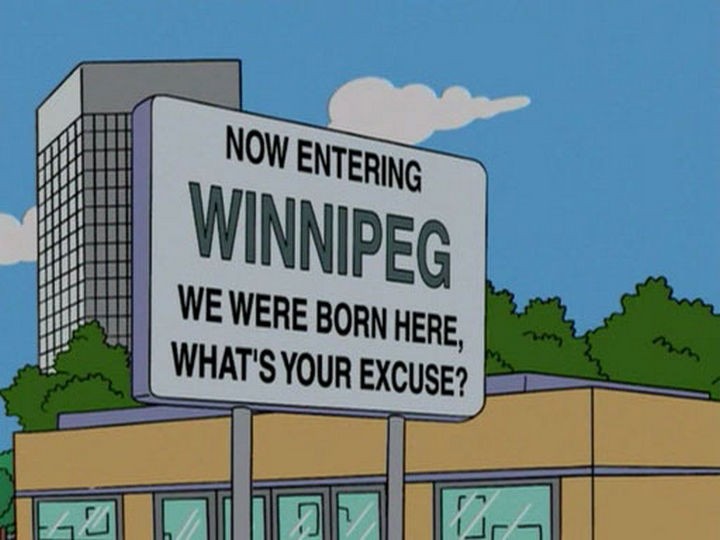 31 Funny Simpsons Signs - "Now entering Winnipeg. We were born here, what's your excuse?"