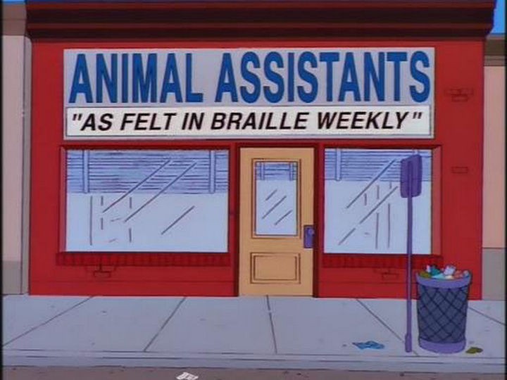 31 Funny Simpsons Signs - "Animal Assistants - As felt in Braille Weekly."