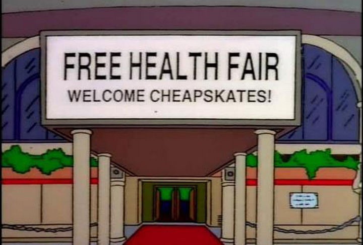 31 Funny Simpsons Signs - "Free Health Fair - Welcome cheapskates!"