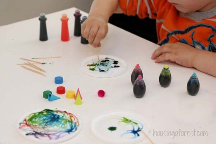 36 Summer Activities for Kids That Cost Less Than $10 - Create unique sun-catchers by painting wet glue with food coloring.