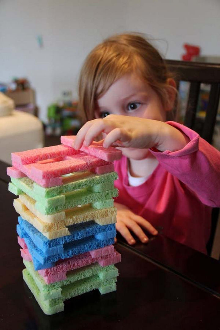 36 Summer Activities for Kids That Cost Less Than $10 - Build a fun Jenga-style tower game with sponge pieces.