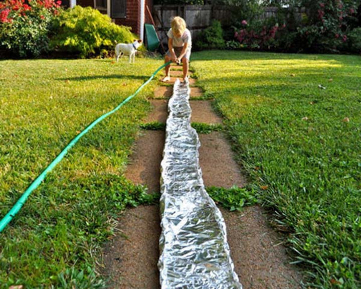 36 Summer Activities for Kids That Cost Less Than $10 - Make a river in the backyard with foil.