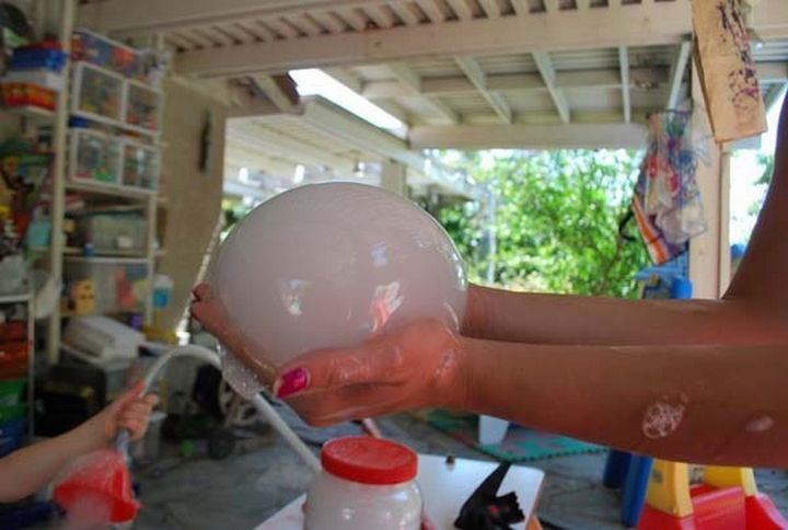 36 Summer Activities for Kids That Cost Less Than $10 - Get kids excited about science by making cool alien bubbles.