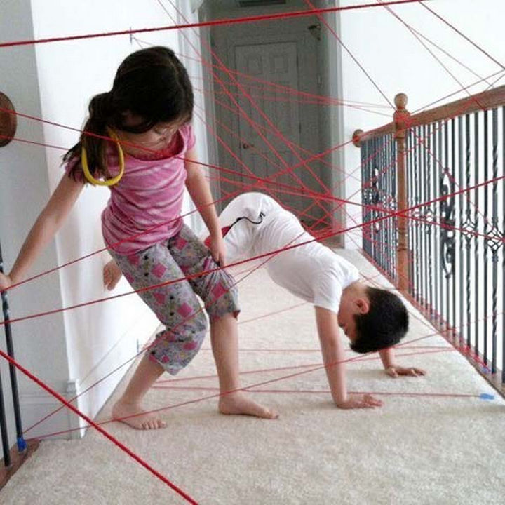 36 Summer Activities for Kids That Cost Less Than $10 - Create a field of lasers to avoid using only strands of yarn.