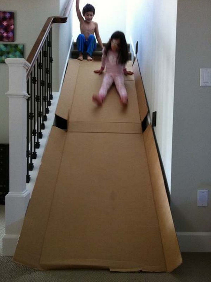 Make a super slide with an old cardboard box.