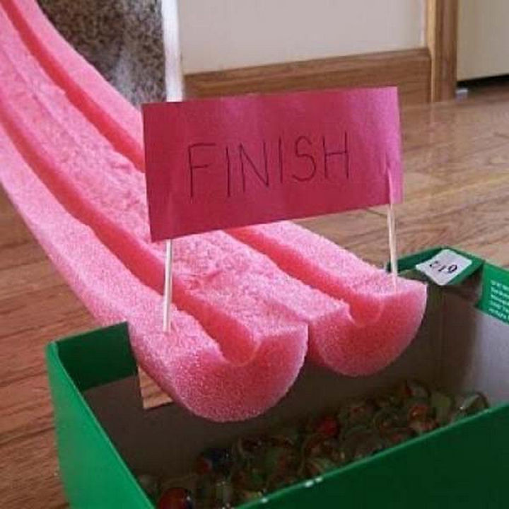 Build a marble race track using a pool noodle.