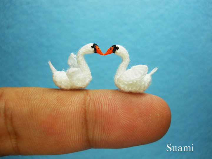 Micro crochet swans in love.