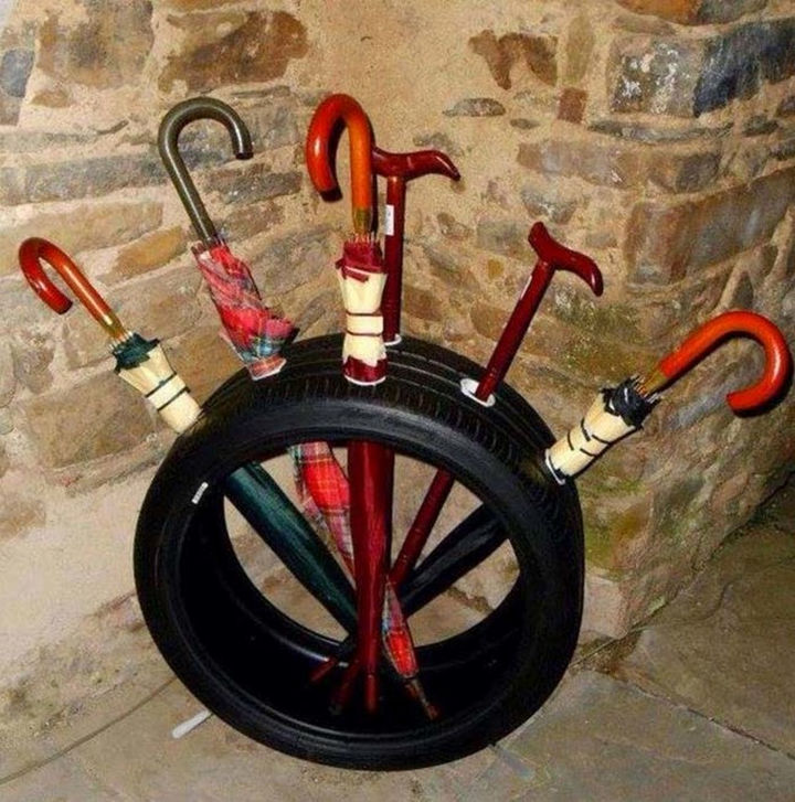 22 Awesome Ways to Turn Used Tires Into Something Great - Create a unique umbrella stand.