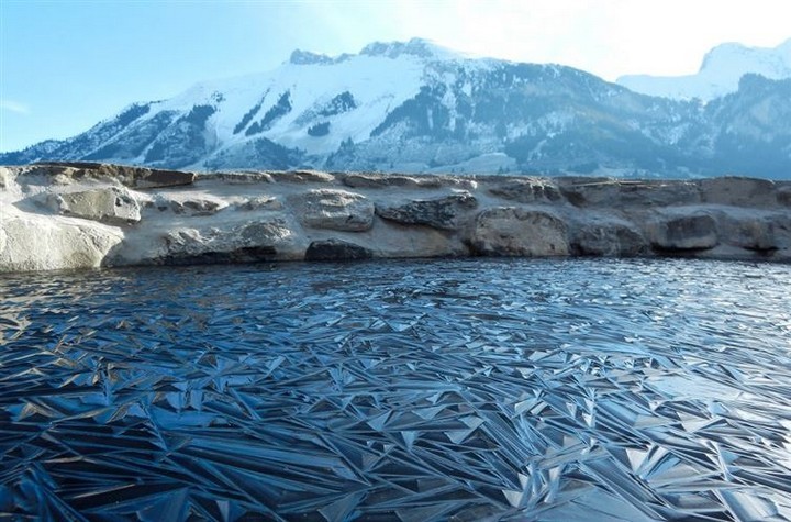 21 Awe-Inspiring Photos - A pond frozen into intricate geometric shapes.