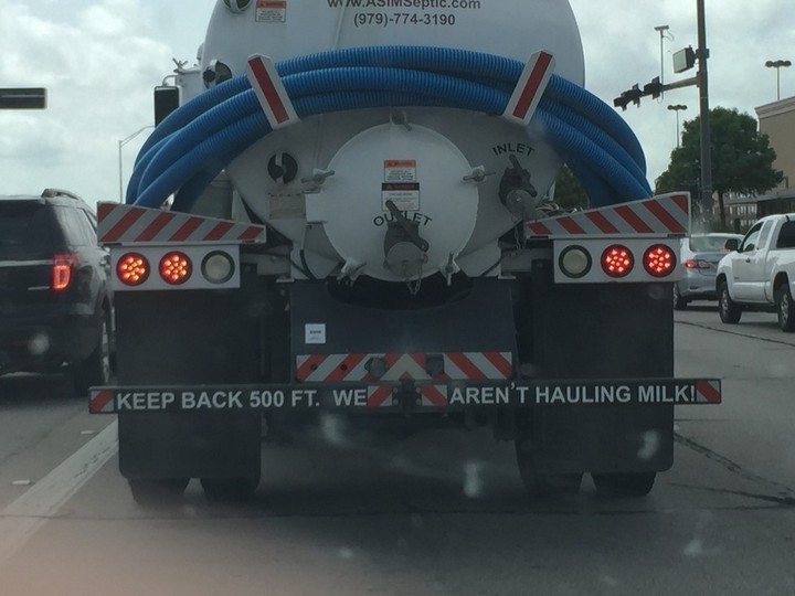 31 Funny Truck Signs - It sure doesn't smell like milk.