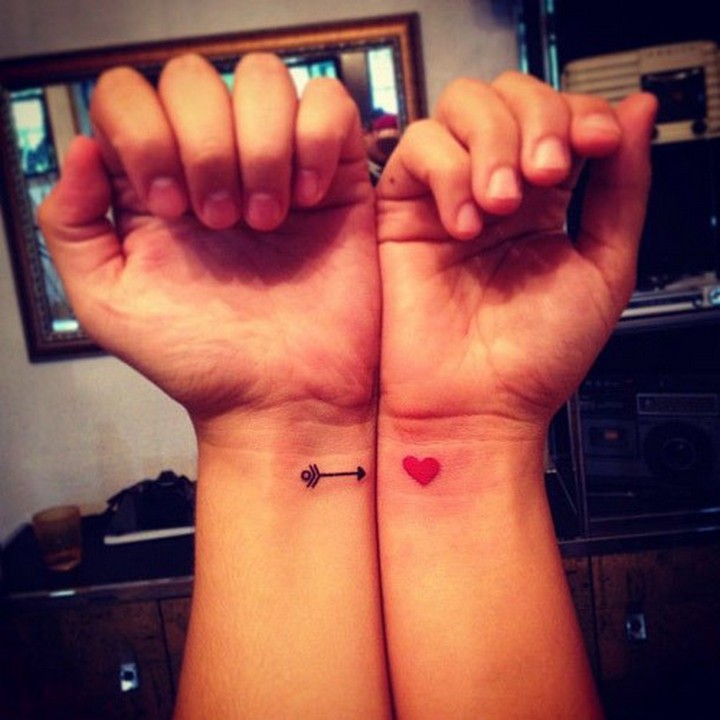 35 couple tattoos - Cupid's arrow couple tattoos.