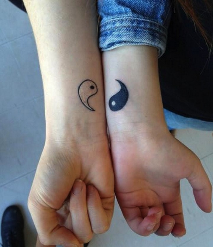 35 couple tattoos - Yin and Yang couple tattoos.