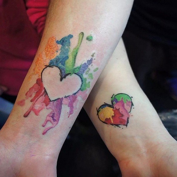 35 couple tattoos - Inverted hearts couple tattoos.