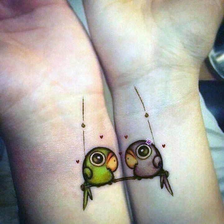 35 couple tattoos - Love birds couple tattoos.