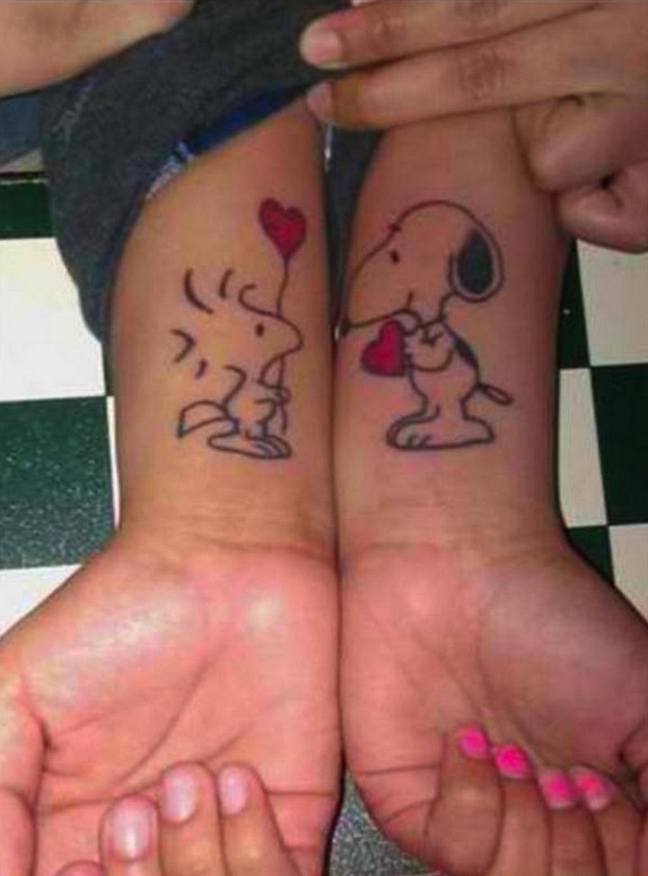 35 couple tattoos - Snoopy loves Woodstock couple tattoos.