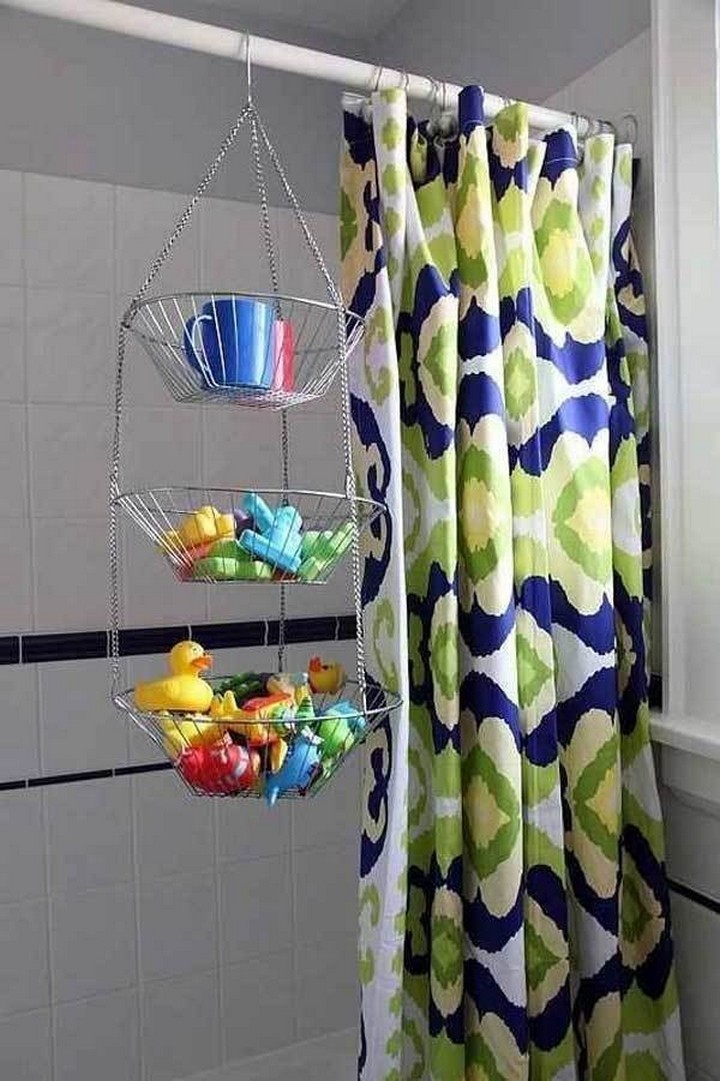 46 Useful Storage Ideas - Store wet toys after bath time in a metal hanging fruit basket.