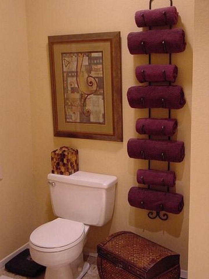 46 Useful Storage Ideas - Use a wine rack to hold bath towels.