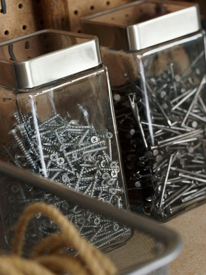 46 Useful Storage Ideas - Use glass or plastic kitchen canisters to organize screws and nails.