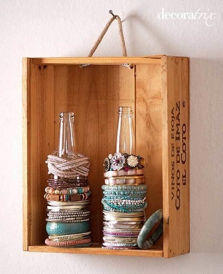 46 Useful Storage Ideas - Use empty glass bottles as bracelet holders.