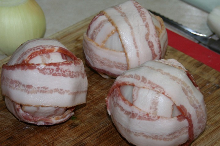 Once you've create all your meatballs, wrap them with three slices of bacon and secure bacon with toothpicks.