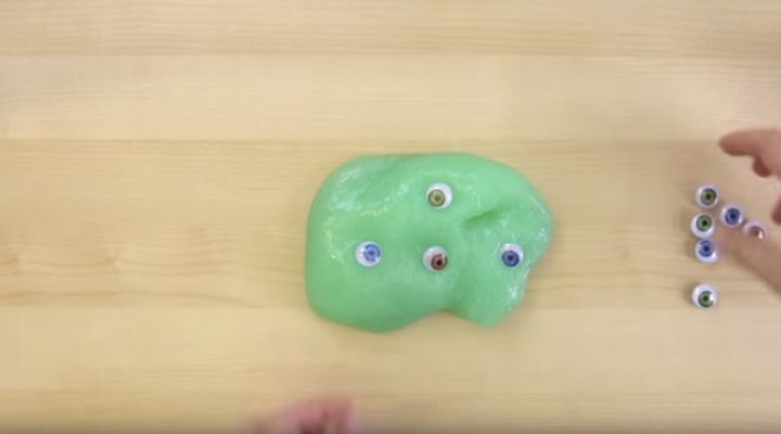 How to make weird slime - Step 7: Add 'eyeballs' to your slime and knead gently to incorporate them into the slime.