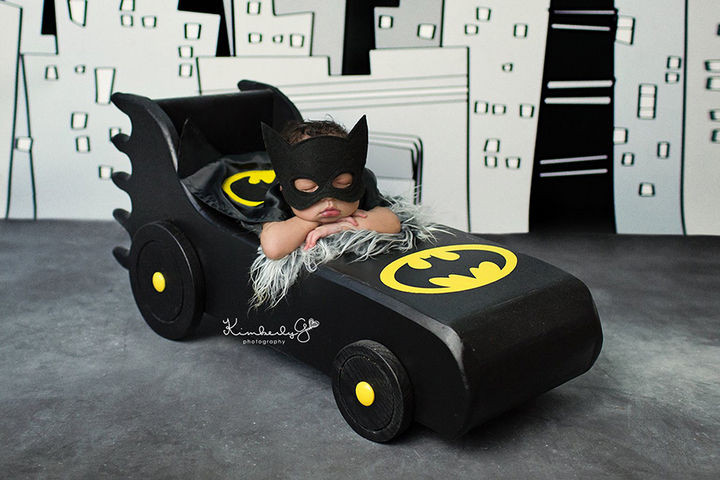 37 Newborns Wearing Geek Baby Clothes - Baby Batman taking a nap.