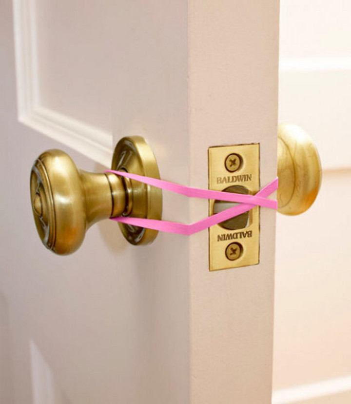 47 Amazing Life Hacks - Rubber Band - Prevent kids from accidentally locking the door or make a door easy to open if you have your hands full by using a rubber band.