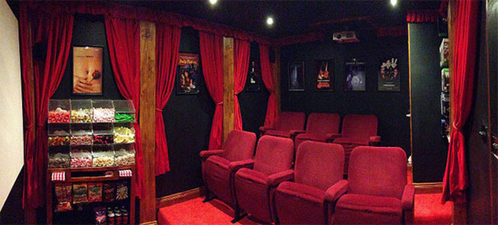 The inside of the shed is a full-blown home theater with projector and authentic plush theater seats.