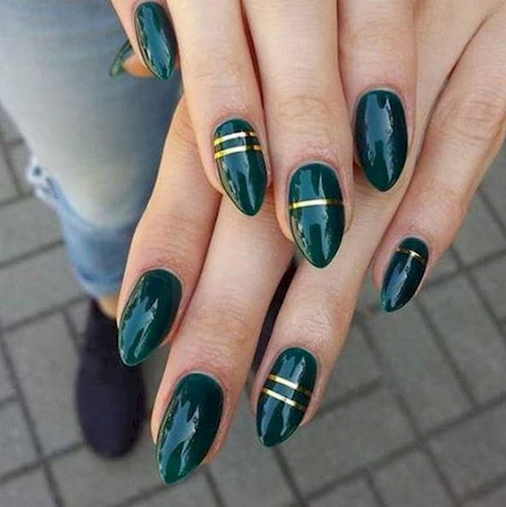18 Green Manicures - Add some flair with gold striping tape.