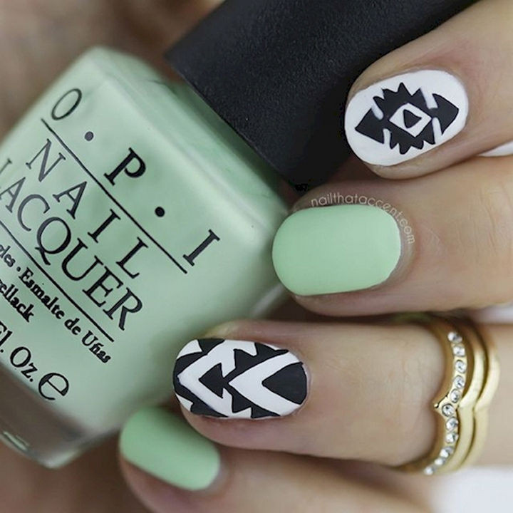 18 Beautiful Green Nails for Fall - A beautiful shade of green with white and black accent nails.