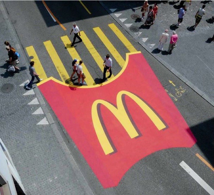 21 Creative Billboard Ads - Pedestrians crossing over French fries.