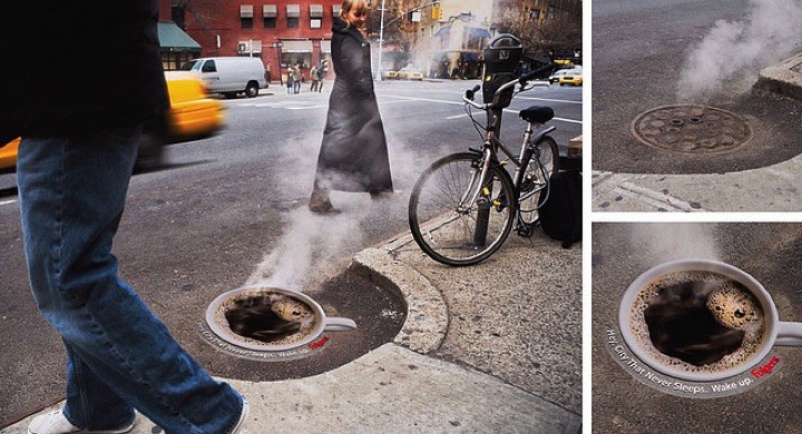 21 Creative Billboard Ads - A coffee ad over a manhole cover demonstrating a steaming hot cup of coffee.