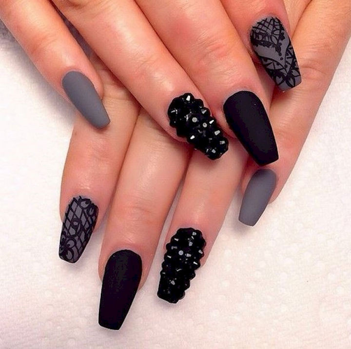 22 Black Nails That Look Edgy and Chic - Show off your creativity with rock nails.