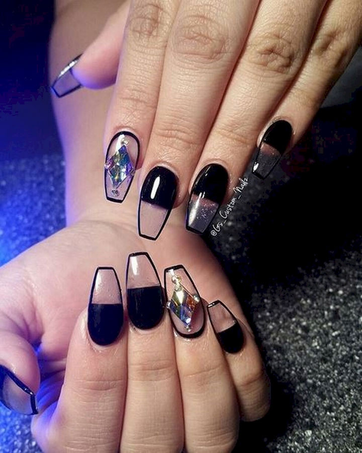 22 Black Nails That Look Edgy and Chic - Rock negative space nails with this look.